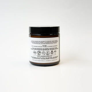 Lavender Thorne Lavender Thorne Affirmation stretch mark and belly butter moisturizer jar with lavender and floral design.