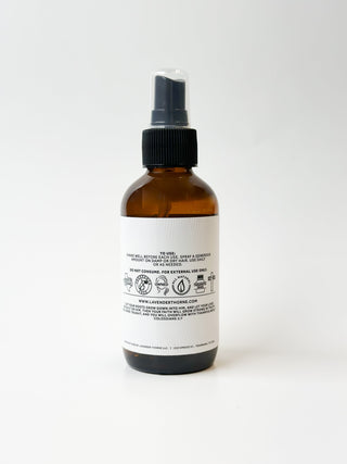 Lavender Thorne Hair Growth Serum bottle with dropper, featuring lavender flowers, designed to promote healthy hair growth.