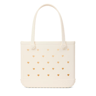 In Love BABY BOGG BAG Coconut
Beige tote bag with gold heart patterns on a white background