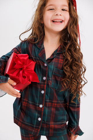In My Jammers girl's ruffle flare 2-piece pajama set featuring holiday heritage plaid fabric and ruffle details.