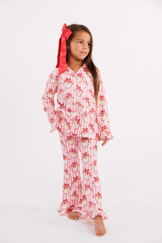 In My Jammers girl's ruffle flare 2-piece pajamas set in pink Santa Claus Lane with festive ruffle details.