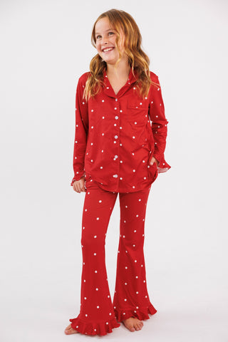 In My Jammers girl's ruffle flare 2-piece pajamas set in ruby polka dot fabric, featuring a top with ruffle details and matching pants