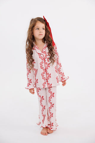 In My Jammers girl's ruffle flare pajamas set with vintage bows and blossom pattern, soft fabric, and ruffled details.
