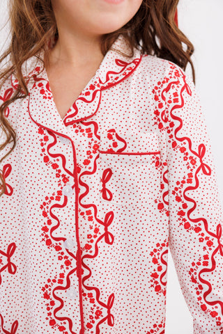 In My Jammers girl's ruffle flare pajama set with vintage bows and blossom patterns, featuring a two-piece design and ruffled details.
