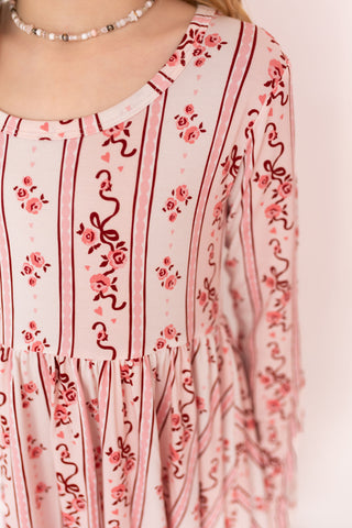 In My Jammers Long Sleeve Twirl Dress - Vintage Love
Pink floral and stripe patterned dress with a white background