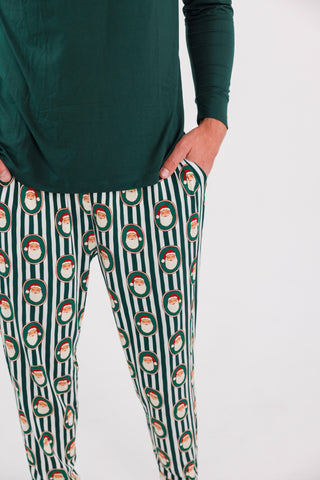 Men's green Santa Claus Lane jogger pajamas from In My Jammers, comfortable cotton lounge pants with festive holiday print.