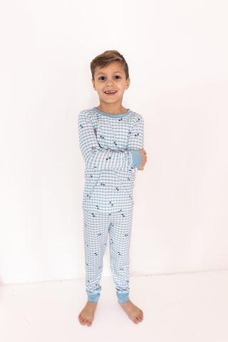 In My Jammers Two Piece Set - Blue XO Gingham
Child wearing a blue checkered pajama set on a white background