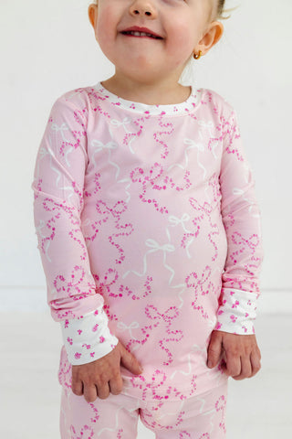 In My Jammers Two Piece Set - Cora
Child wearing pink floral pajamas against a white background