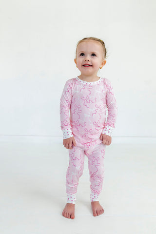 In My Jammers Two Piece Set - Cora
Child wearing pink floral pajamas on a white background