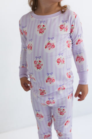In My Jammers Two Piece Set - Petal Pop
Child wearing a floral pajama set on a white background