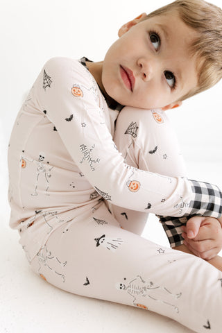 In My Jammers Two Piece Set - The Boo Crew
A young child wearing a long-sleeve pajama top and matching pants with a Halloween print, posed against a clean white background.
