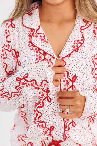 In My Jammers women's long sleeve pajama set with vintage bows and blossoms, featuring ruffle details and button-up design.