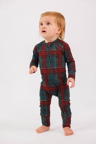 In My Jammers zipper romper pajamas in holiday heritage plaid, featuring a zipper front and cozy holiday-themed design.