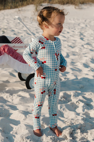 In My Jammers Little Cherry zipper romper pajamas for kids, featuring a cherry print and soft fabric with a front zipper.