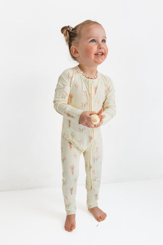 In My Jammers Zipper Romper - Tulip Fields
Child wearing a floral onesie on a white background