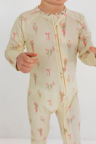 In My Jammers Zipper Romper - Tulip Fields
Child wearing a floral patterned onesie on a white background