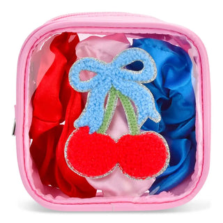 Iscream Cherry on Top scrunchie set featuring colorful fabric scrunchies with cherry-themed design and elastic hair accessories.