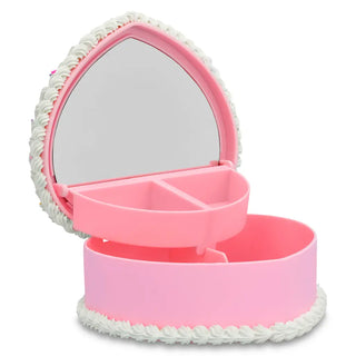 Iscream Heart Cake Jewelry Box
Pink heart-shaped compact mirror with white rope detailing on a white background