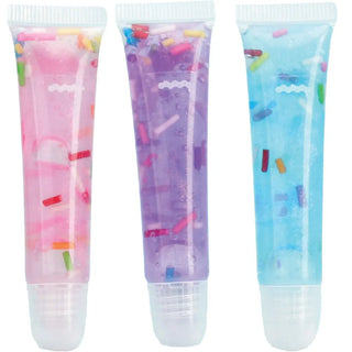 Iscream Sprinkle Lip Gloss Set
Three colorful lip balms with sprinkles in pink, purple, and blue on a white background.