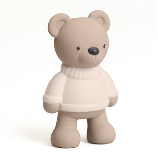 Itzy Ritzy Comfort Crew™ - Bear Beige teddy bear wearing a white sweater on a white background