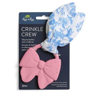 Itzy Ritzy Crinkle Crew™ teether with a colorful bow design, soft fabric and crinkly texture for sensory play and teething relief.