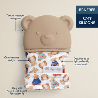 Itzy Ritzy Vintage Bear teething mitt with soft fabric and plush bear design for soothing teething relief in baby’s hand.