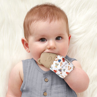 Itzy Ritzy Vintage Bear teething mitt with soft fabric and plush bear design for soothing babies during teething.
