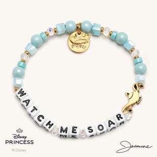 Little Words Project Bracelet - Disney Princess: Jasmine
Bracelet with turquoise beads and gold charms, featuring the text 'Watch Me Soar' and Disney Princess logo.