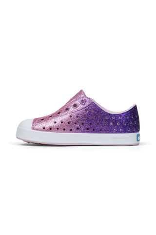 Native Jefferson Bio-Bling™ - Parachute Glamour Bling / Shell White
Purple glitter sneaker with white sole on a white background