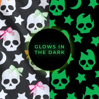 Posh Peanut Kelly Skelly Glow in the Dark Twirl Dress
Pattern of skulls, stars, and bows with 'Glow in the Dark' text on a black background.