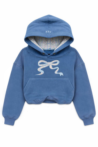 KatieJ NYC Tween Ryan Bubble Hoodie
Blue hoodie with a white bow design on a white background