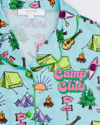 Kids wearing Sunshine Society Camp Club silky short sleeve pajama set, featuring a colorful, comfortable design for bedtime.