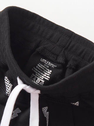 Little Bipsy Lightning Bolt Jogger - Black
Close-up of a black hoodie with a brand label on a white background