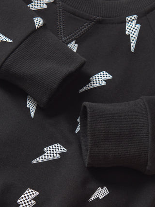 Little Bipsy Lightning Bolt Pullover - Black
Black sweater with white geometric pattern on a matching background
