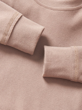 Little Bipsy Long Sleeve Ribbed Tee - Mushroom
Close-up of a beige corduroy shirt with rolled-up sleeves.