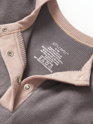 Little Bipsy Colorblock Ribbed Romper - Graphite
Close-up of a label on a piece of clothing with 'LITTLEBIG' branding.