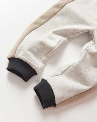 Little Bipsy Side Stripe Jogger - Stone Grey
Close-up of a beige and black jacket on a light background