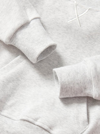 Little Bipsy Pocket Pullover - Light Heather Grey
Close-up of a gray sweater with a brand logo on a light gray background