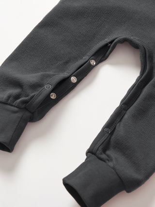 Little Bipsy Waffle Romper - Shadow
Dark gray baby onesie with buttons on a white background