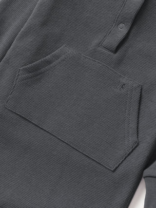 Little Bipsy Waffle Romper - Shadow
Close-up of a dark gray textured shirt with a pocket