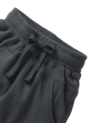 Little Bipsy Jogger - Shadow
Dark gray sweatpants with a drawstring on a light gray background