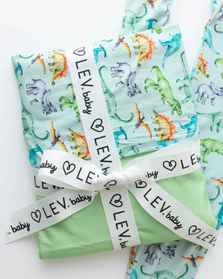 Lev Baby Blanket - Landon
Folded baby blankets with dinosaur pattern and 'LEV baby' branding on a white background