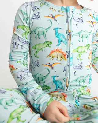 Lev Baby Poppy Convertible Zipper Romper - Landon
Children's onesie with colorful dinosaur pattern on a light blue background