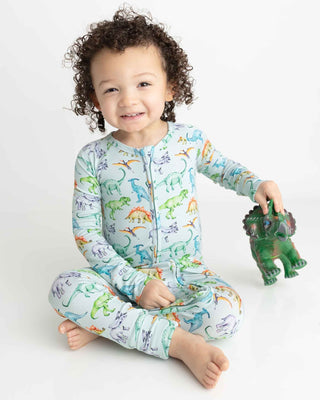 Lev Baby Poppy Convertible Zipper Romper - Landon
Child wearing a dinosaur-themed onesie holding a toy on a white background