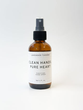 Lavender Thorne Clean Hands Pure Heart hand spray in a clear bottle with a lavender-scented soap, designed for hand hygiene and freshness.