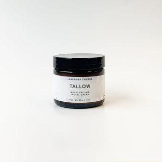 Lavender Thorne Tallow Face Moisturizer jar with a white lid, showcasing a smooth, creamy texture in a clean, minimalist setting.