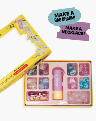 Super Smalls Mermaid Magic Lip Balm Bead Kit
Jewelry-making kit with beads and tools, featuring text 'Make a Bag Charm!' and 'Make a Necklace!'.