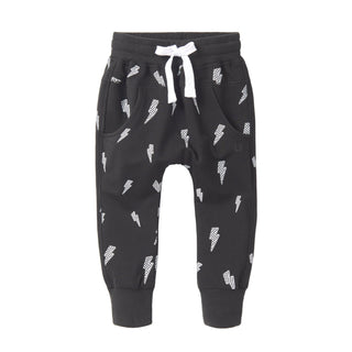Little Bipsy Lightning Bolt Jogger - Black
Black jogger pants with white pattern on a white background