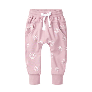 Little Bipsy Smiley Jogger - Dusty Purple
Pink baby pants with smiley face pattern on a white background
