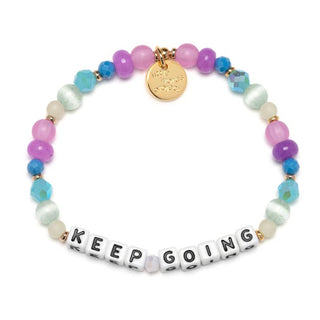 Little Words Project Bracelet - Keep Going: Soft Layers
A beaded stretch bracelet with pastel pink, purple, blue, and mint green beads, featuring white letter beads spelling 'KEEP GOING' and a gold-tone charm, shown on a white background.